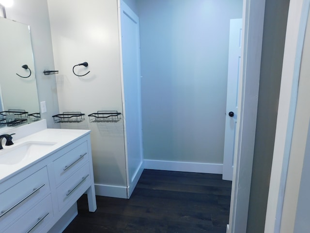 bathroom with hardwood / wood-style flooring and vanity