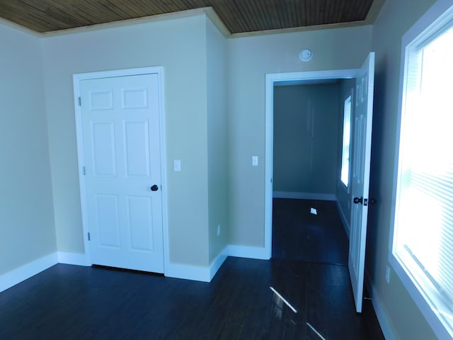 unfurnished room featuring dark wood-type flooring