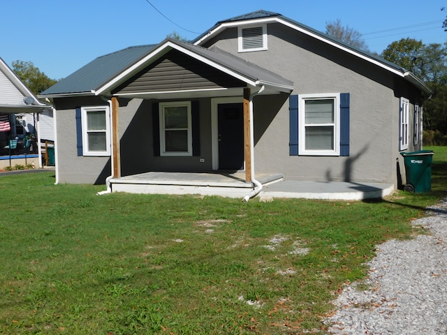 bungalow-style home featuring a front yard