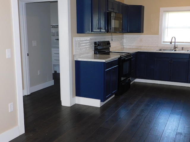 kitchen with blue cabinets, sink, black appliances, dark hardwood / wood-style flooring, and decorative backsplash