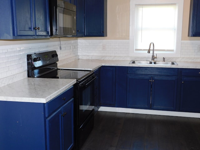 kitchen with dark hardwood / wood-style flooring, black appliances, sink, and blue cabinets