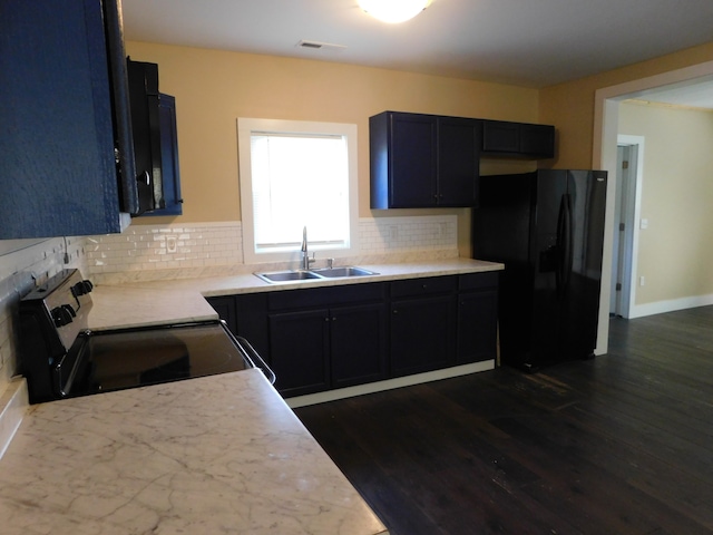 kitchen with sink, backsplash, dark wood-type flooring, black refrigerator with ice dispenser, and stainless steel electric range oven