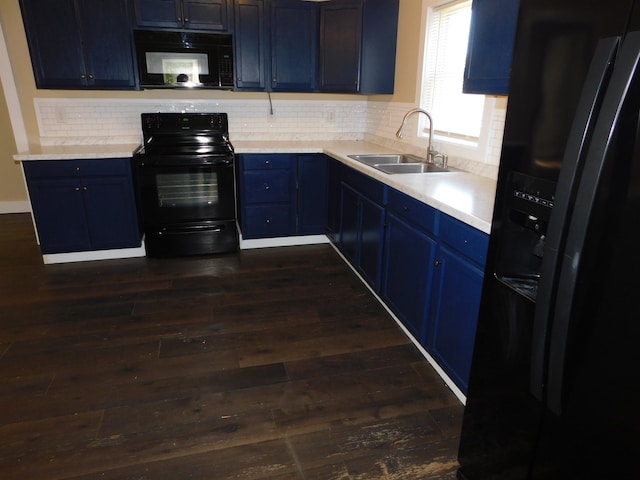 kitchen with blue cabinetry, sink, decorative backsplash, dark hardwood / wood-style floors, and black appliances