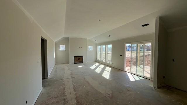 unfurnished living room with vaulted ceiling