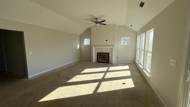 unfurnished living room featuring vaulted ceiling and ceiling fan