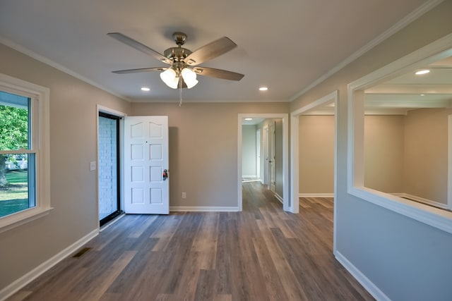 spare room featuring ceiling fan, dark hardwood / wood-style floors, and ornamental molding