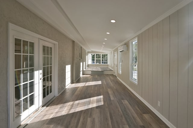 hallway with dark hardwood / wood-style floors, crown molding, french doors, and a wall mounted air conditioner