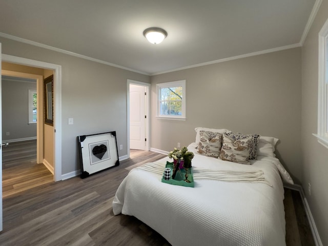 bedroom featuring wood-type flooring and ornamental molding