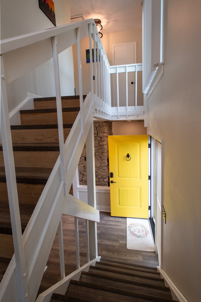 stairs with hardwood / wood-style floors