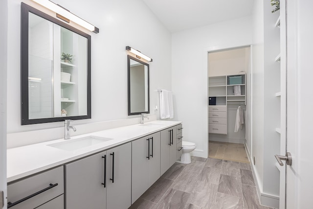 bathroom with hardwood / wood-style floors, toilet, and vanity