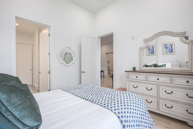 bedroom with light hardwood / wood-style flooring