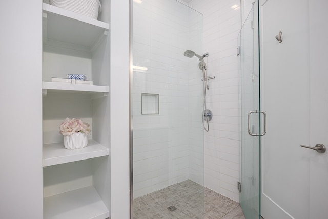 bathroom with a shower with shower door