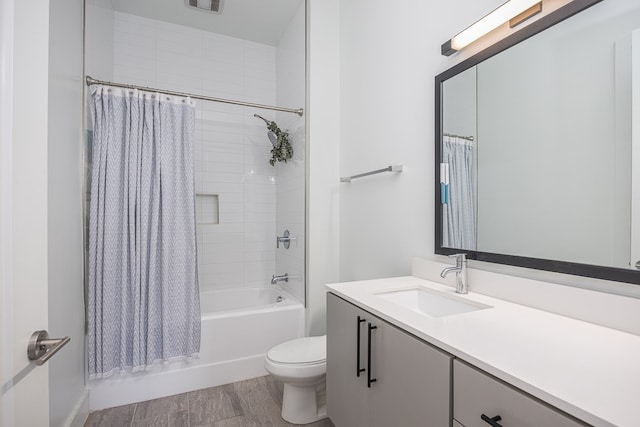 full bathroom with hardwood / wood-style floors, shower / bath combination with curtain, toilet, and vanity