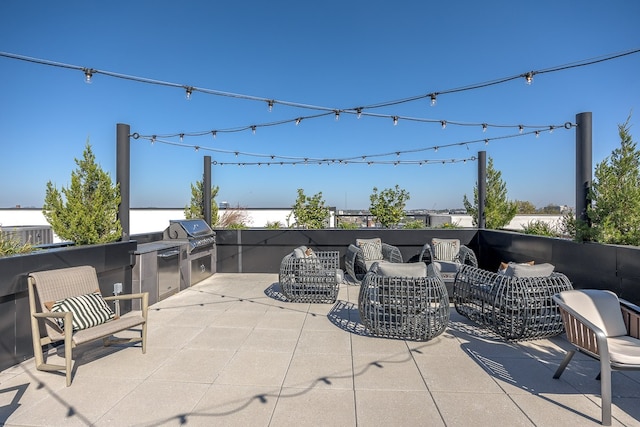 view of patio featuring an outdoor kitchen and area for grilling