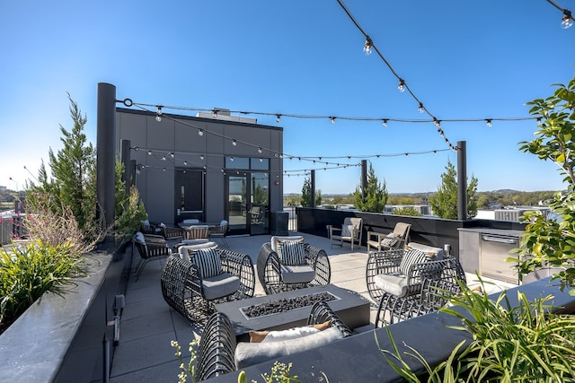 view of patio with an outdoor living space and exterior kitchen