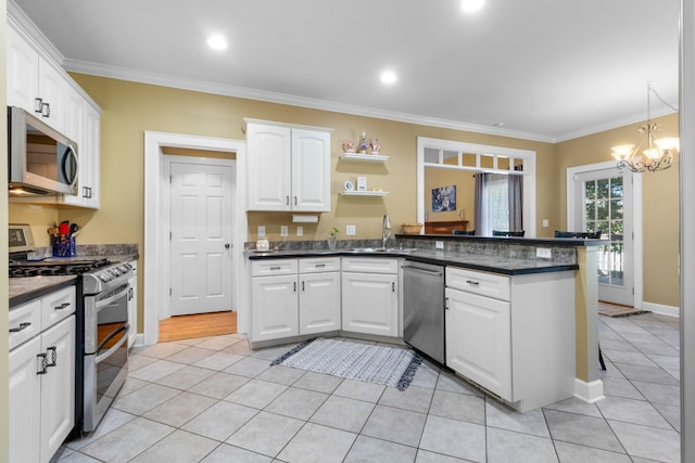 kitchen featuring kitchen peninsula, ornamental molding, white cabinets, and appliances with stainless steel finishes