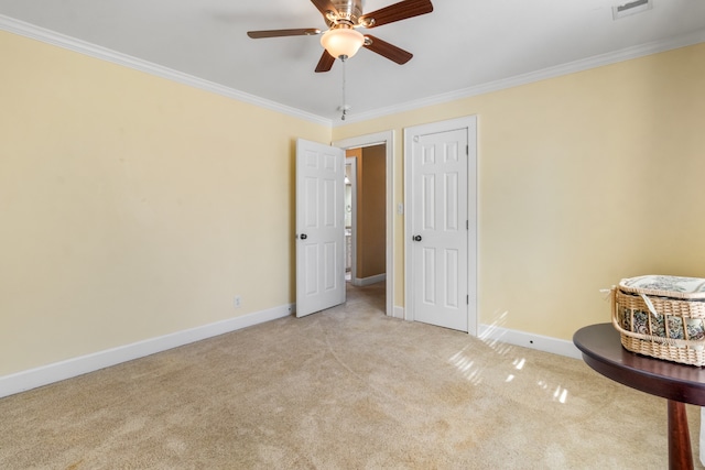 unfurnished bedroom with ceiling fan, light carpet, and ornamental molding