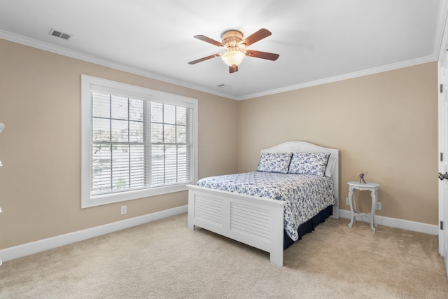 bedroom featuring crown molding, ceiling fan, and light colored carpet