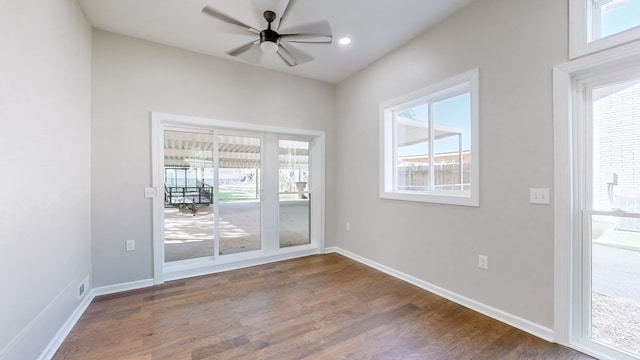 doorway to outside with ceiling fan and dark wood-type flooring