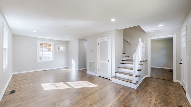 basement with hardwood / wood-style floors