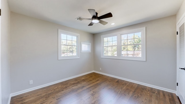 unfurnished room featuring ceiling fan and dark wood-type flooring