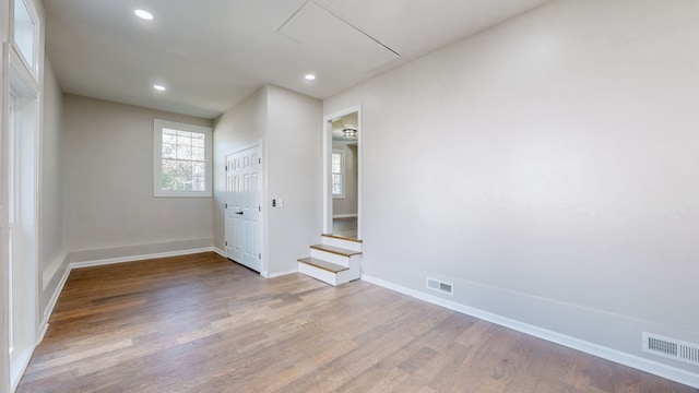 spare room with wood-type flooring