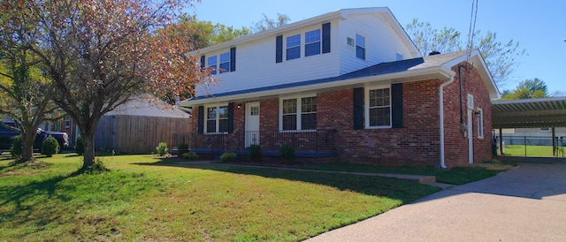 view of front of house featuring a carport and a front lawn