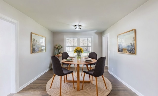 dining space featuring dark hardwood / wood-style floors