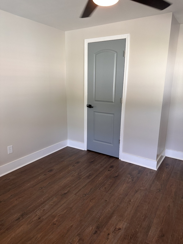 spare room with dark hardwood / wood-style floors