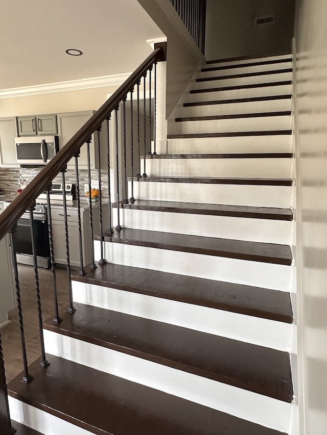 stairs featuring ornamental molding