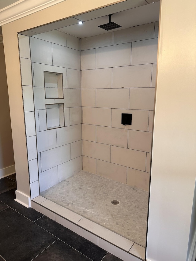 292 Quebeck Rd, Quebeck, TN 38579 - bathroom featuring tiled shower, tile patterned floors, and baseboards