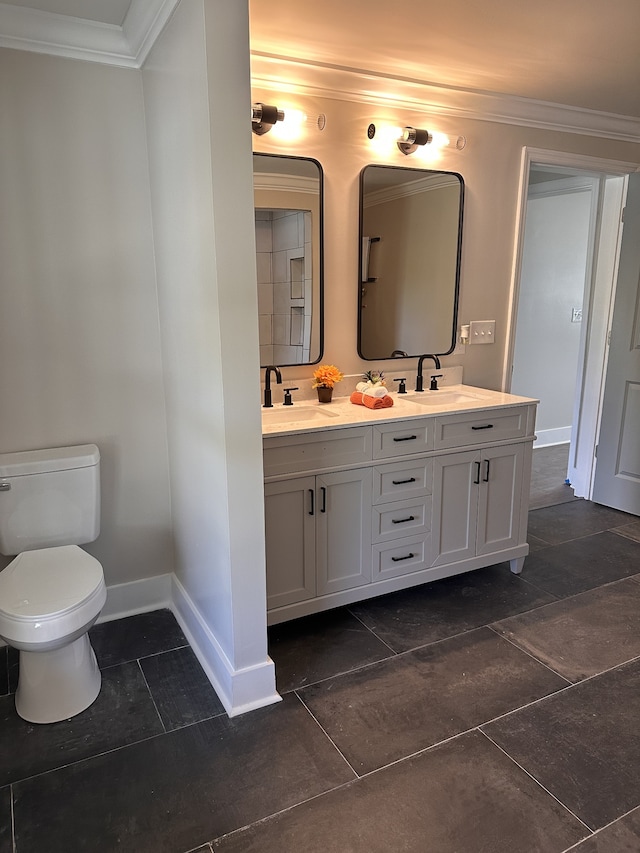 bathroom with tile patterned flooring, crown molding, vanity, and toilet