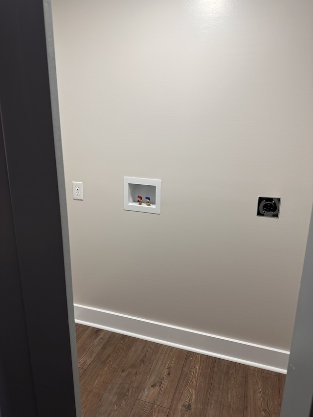 laundry area with hookup for a washing machine, dark hardwood / wood-style flooring, and electric dryer hookup