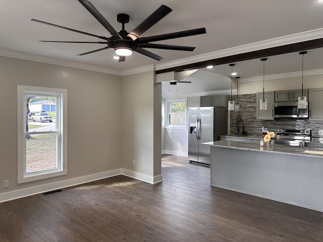 kitchen with stainless steel appliances, plenty of natural light, gray cabinets, and light stone countertops