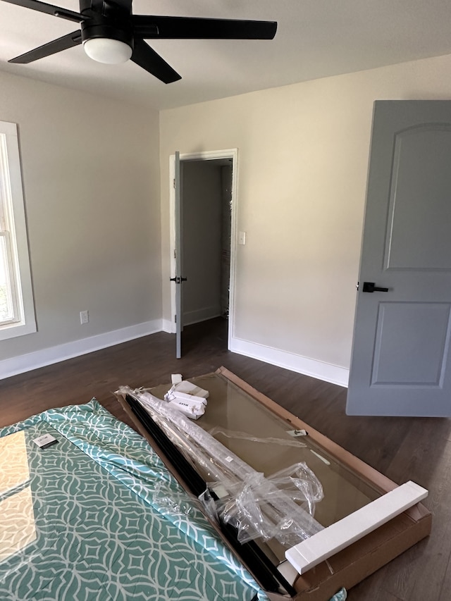 bedroom featuring ceiling fan and dark hardwood / wood-style flooring