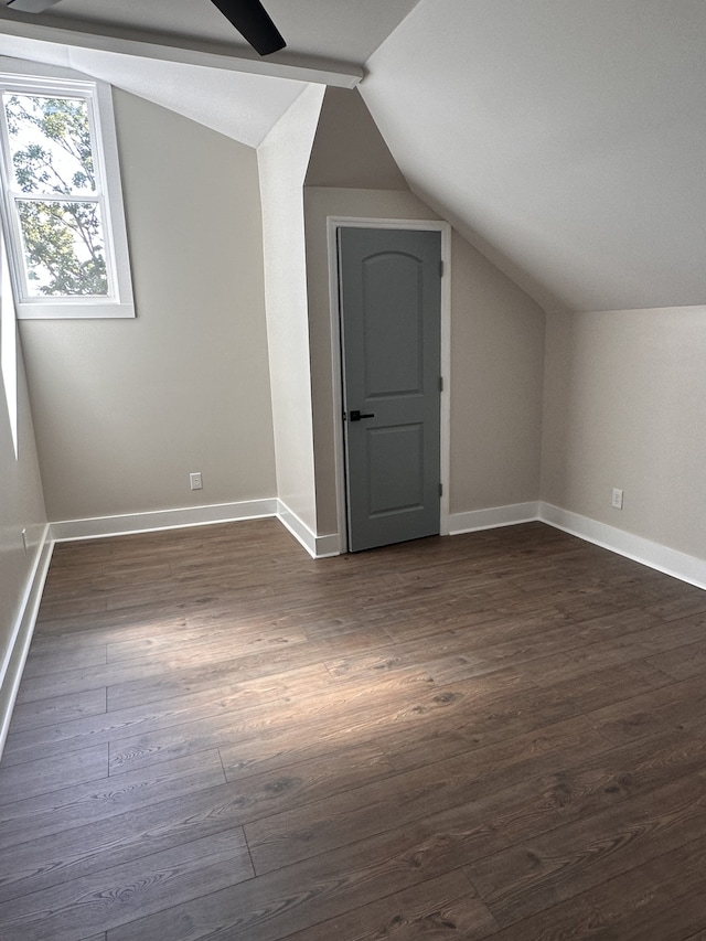 additional living space with lofted ceiling and dark hardwood / wood-style floors