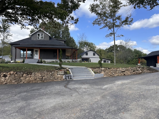 farmhouse inspired home featuring a porch