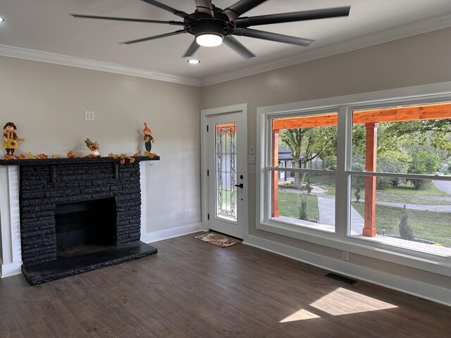 292 Quebeck Rd, Quebeck, TN 38579 - unfurnished living room with ornamental molding, visible vents, dark wood-style flooring, and baseboards