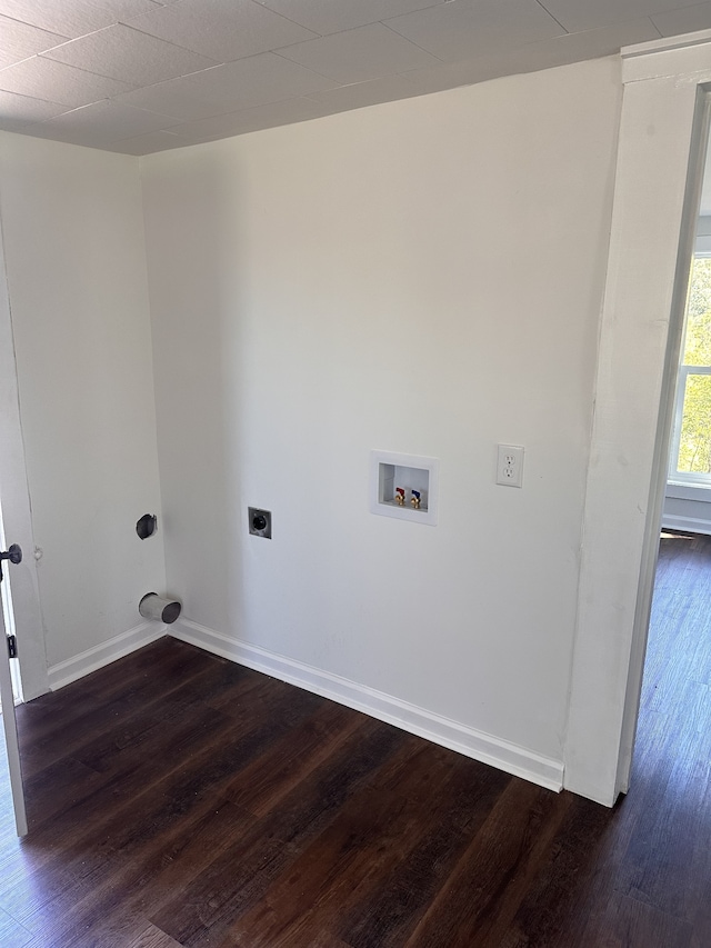 clothes washing area with dark wood-type flooring, hookup for an electric dryer, and hookup for a washing machine