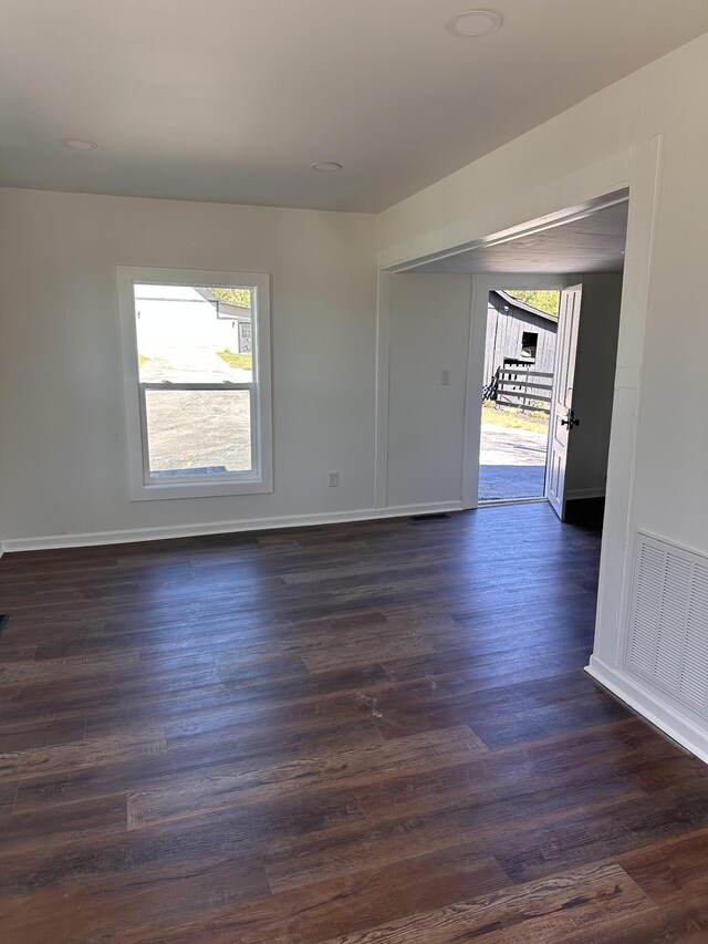 292 Quebeck Rd, Quebeck, TN 38579 - spare room with visible vents, dark wood-style floors, and baseboards