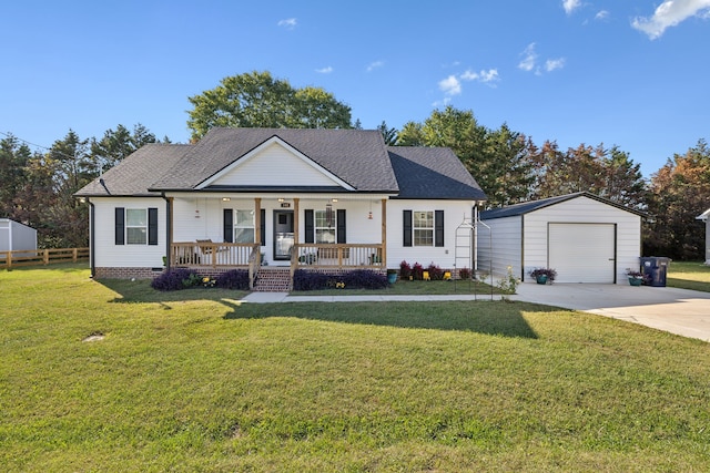 view of front of home featuring an outbuilding, a porch, a garage, and a front yard