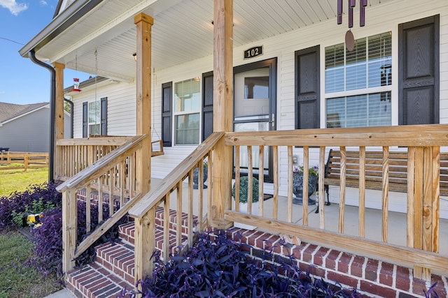 wooden terrace featuring a porch