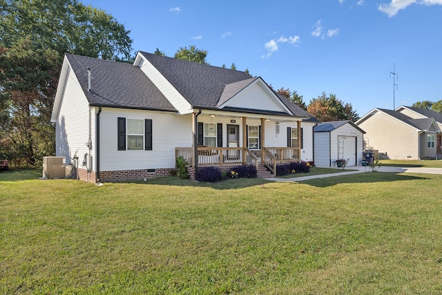 view of front of home with an outdoor structure, a front yard, and covered porch