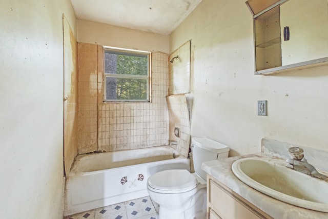 full bathroom featuring vanity, toilet, and tiled shower / bath