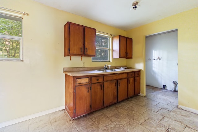 kitchen featuring plenty of natural light and sink