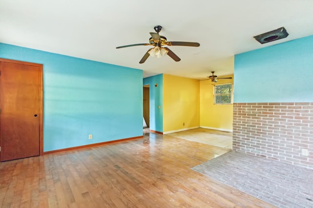 empty room featuring light hardwood / wood-style flooring and ceiling fan