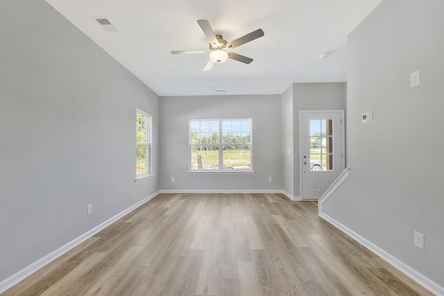 empty room featuring light hardwood / wood-style flooring and ceiling fan