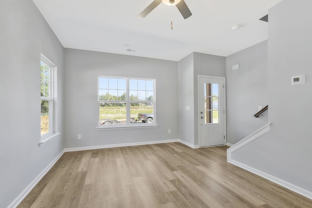 entryway with ceiling fan and light hardwood / wood-style flooring