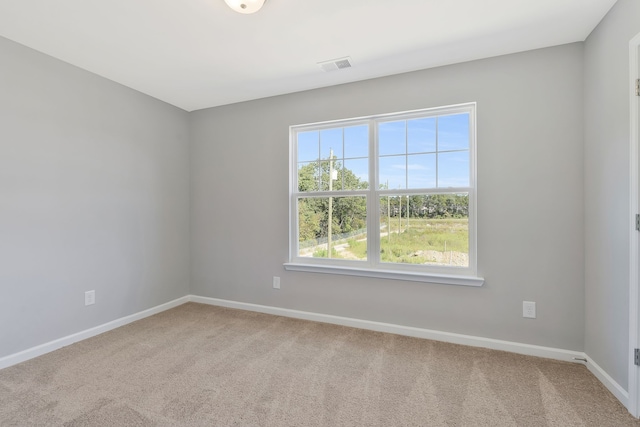 spare room featuring carpet flooring