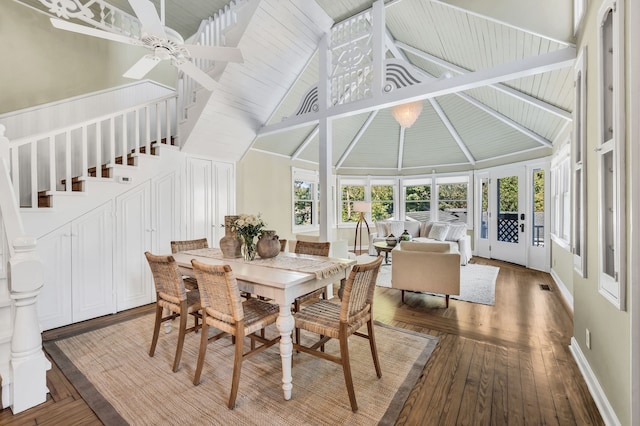 dining space with ceiling fan, wood-type flooring, wooden ceiling, beam ceiling, and high vaulted ceiling